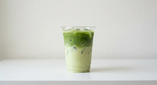 Caffè Nero Iced Pistachio Matcha Latte, pistachio milk and green matcha over ice in a clear cup, nutrition and calories
