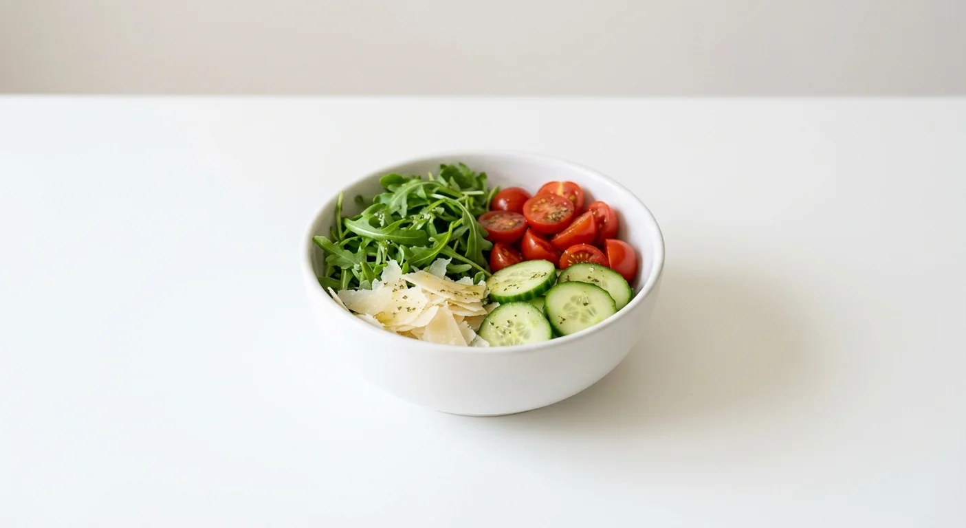 Pret A Manger Classic Green Side Salad, rocket, tomato, cucumber and cheese side salad in a small bowl, nutrition and calories
