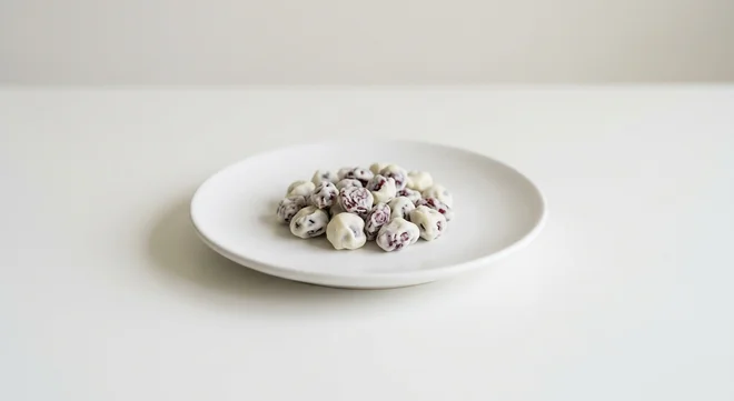 Pret A Manger Cranberries in Coats, yogurt-coated cranberries on a white plate, nutrition and calories