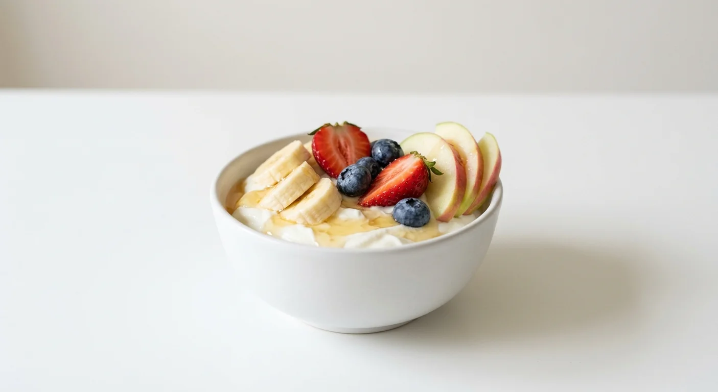 Wetherspoon Fresh Fruit and Yoghurt, Greek-style yoghurt with honey, apple, banana, strawberries and blueberries in a white bowl, nutrition and calories