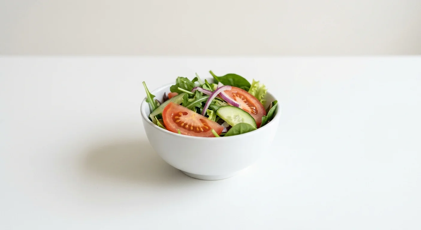 Wetherspoon Side Salad, mixed leaf side salad with tomato, cucumber and red onion in a white bowl, nutrition and calories