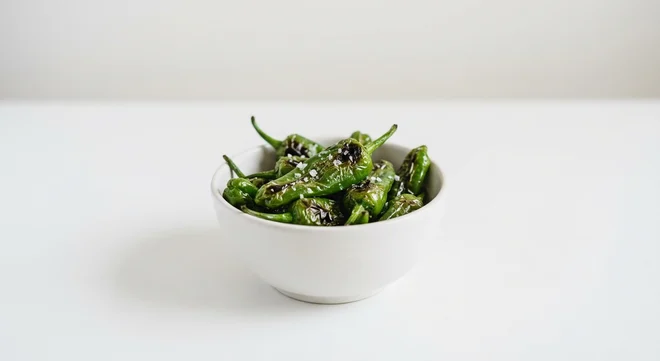 Frankie & Benny's Padron Peppers, blistered green padron peppers with sea salt in a white bowl, nutrition and calories