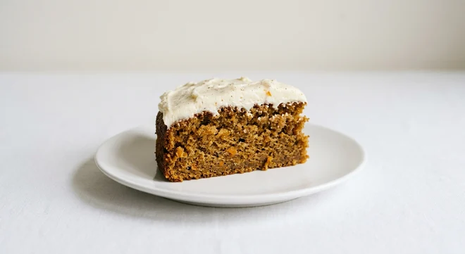 Frankie & Benny's Pumpkin & Ginger Sponge, a slice of spiced pumpkin and ginger sponge with cream cheese frosting on a white plate, nutrition and calories