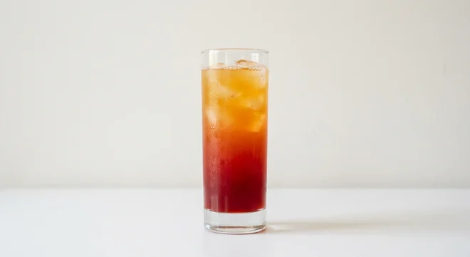Frankie & Benny's New York Sunset Mocktail, layered orange and red fruit mocktail over ice in a tall glass, nutrition and calories