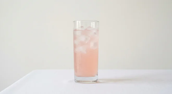 Burger King US Hi-C Pink Lemonade (Small), a pale pink lemonade over ice in a tall clear glass, nutrition and calories