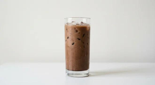 Burger King US Mocha Iced Coffee (Medium), a milky mocha iced coffee over ice in a tall clear glass, nutrition and calories