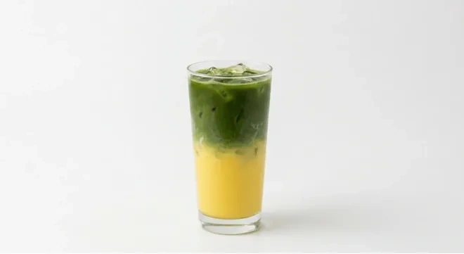 Starbucks US Iced Banana Protein Cream Matcha (Grande), layered iced matcha latte over a yellow banana base in a clear glass, nutrition and calories