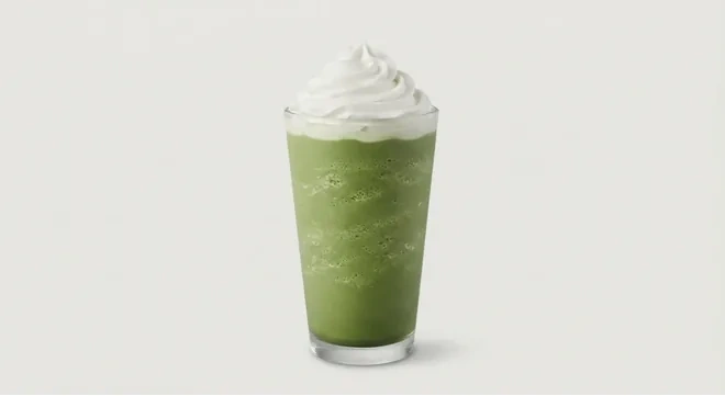 Starbucks US Matcha Crème Frappuccino (Grande), green matcha blended cream drink topped with whipped cream in a clear glass, nutrition and calories