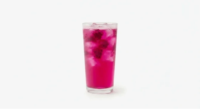 Starbucks US Mango Dragonfruit Refresher (Grande), bright pink mango dragonfruit refresher with fruit pieces over ice in a tall glass, nutrition and calories