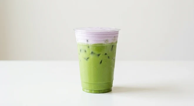 Starbucks US Iced Lavender Cream Matcha (Grande), iced matcha latte topped with lavender cold foam in a clear cup, nutrition and calories