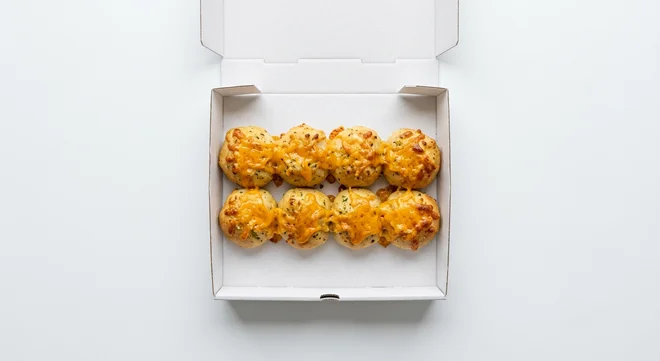 Papa John's Garlic Papa Bites with Cheddar, 8 garlic dough bites with melted cheddar in a takeaway box, nutrition and calories