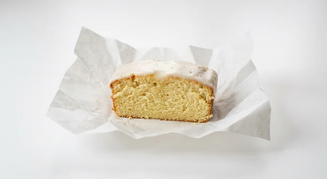 Starbucks US Iced Lemon Loaf, slice of lemon loaf with thick white icing, nutrition and calories