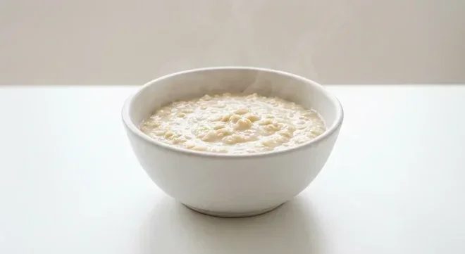 Morrisons Original Oat Sachets, creamy cooked porridge oats in a white bowl with milk, nutrition and calories