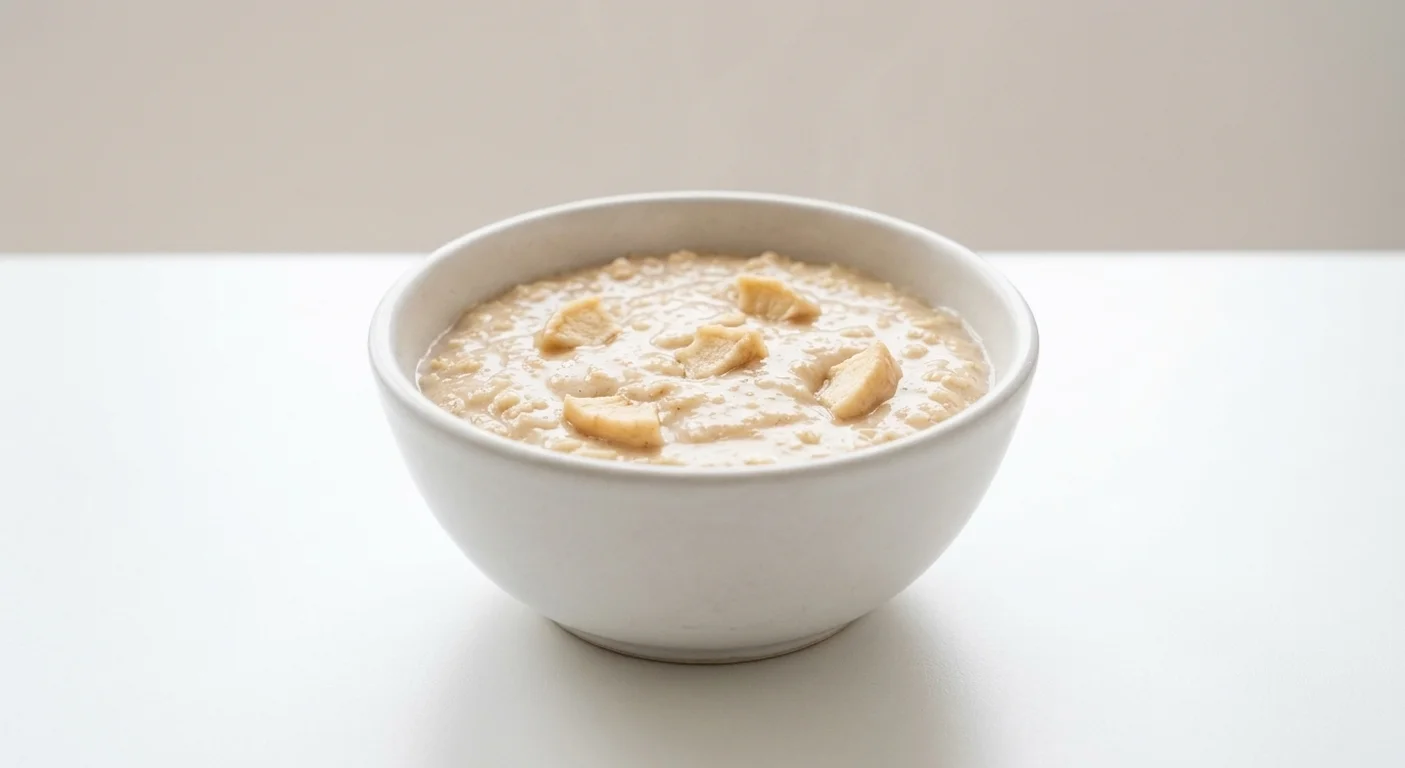 Morrisons Apple & Cinnamon Porridge Pot, cinnamon porridge with small apple pieces in a white bowl with milk, nutrition and calories