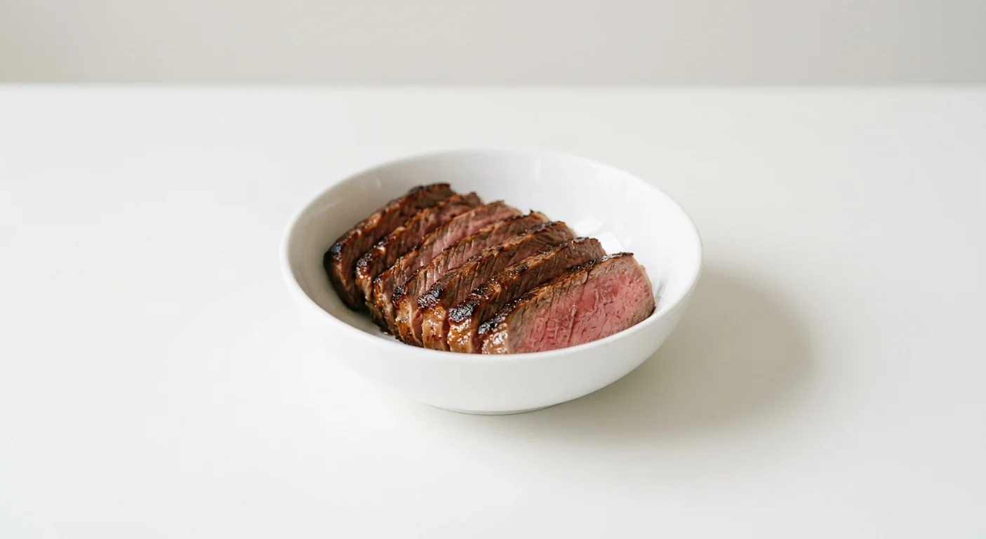 Wagamama Extra Steak, sliced seared sirloin steak with a pink centre in a white bowl, nutrition and calories