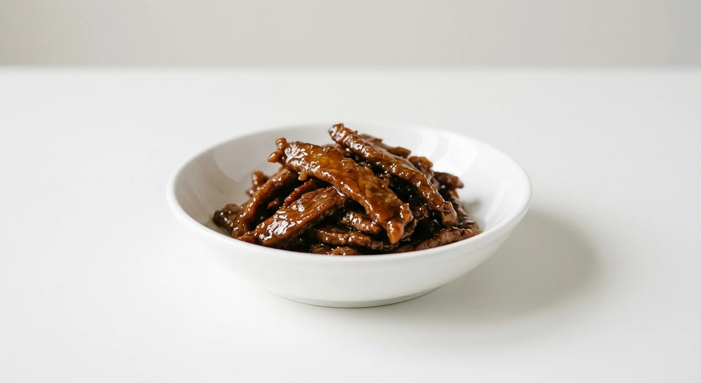 Wagamama Extra Teriyaki Beef, thin strips of beef in a glossy teriyaki glaze in a white bowl, nutrition and calories