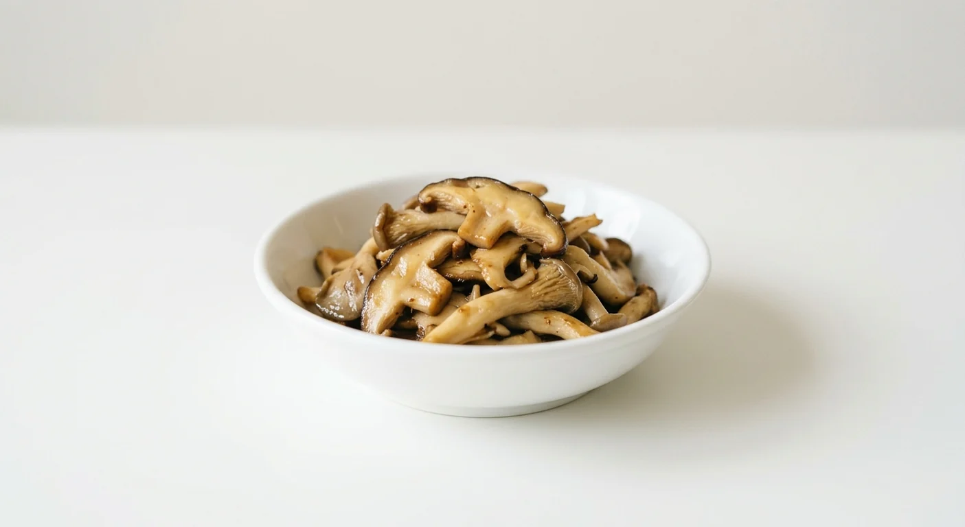 Wagamama Extra Mushroom, sautéed sliced shiitake and oyster mushrooms in a white bowl, nutrition and calories