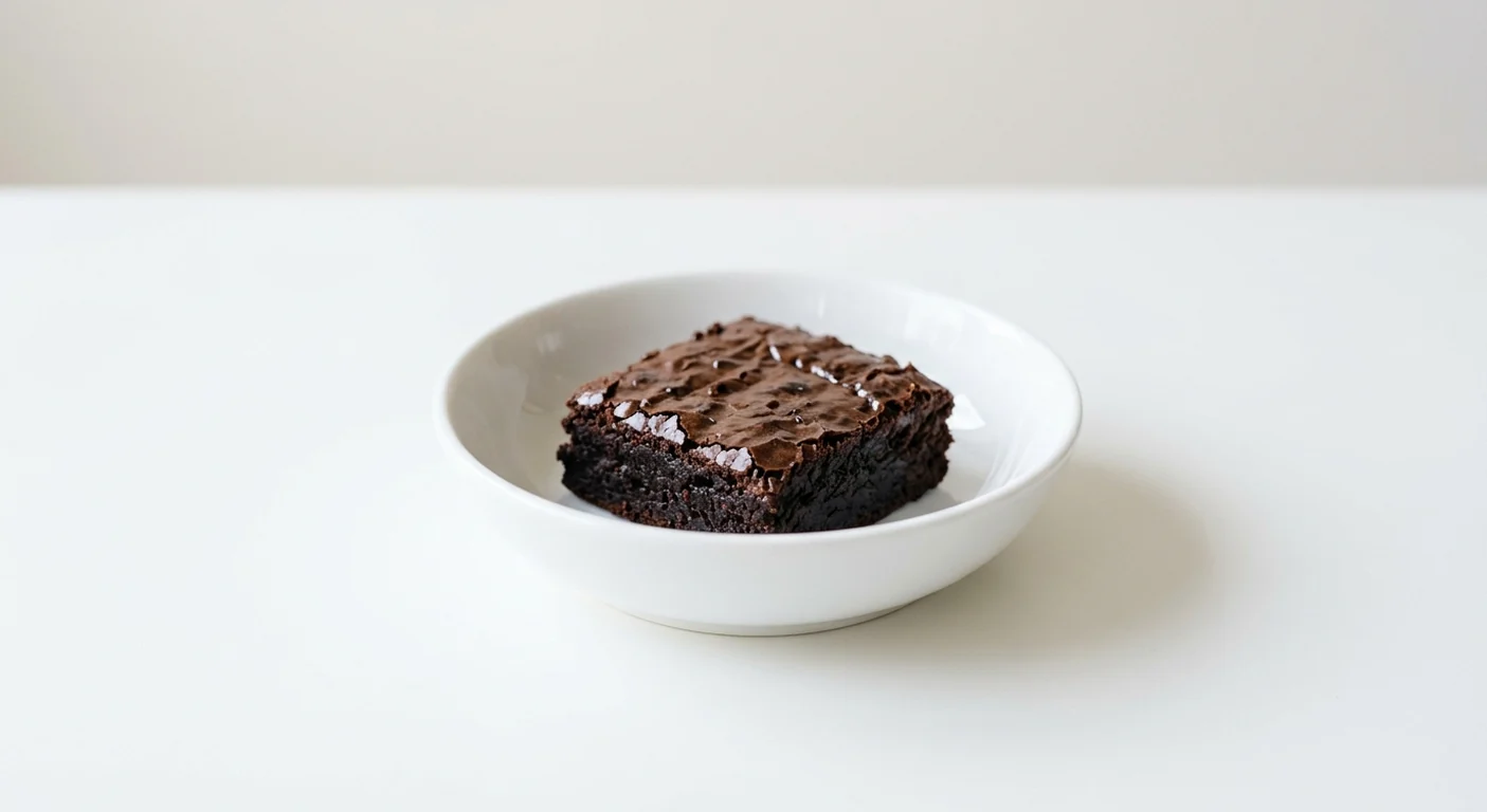 Wagamama Chocolate Brownie, a thick square of fudgy chocolate brownie in a white bowl, nutrition and calories