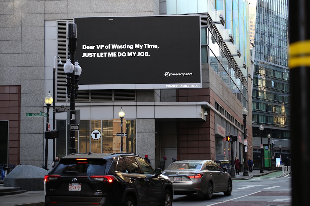 a billboard on the side of a city street