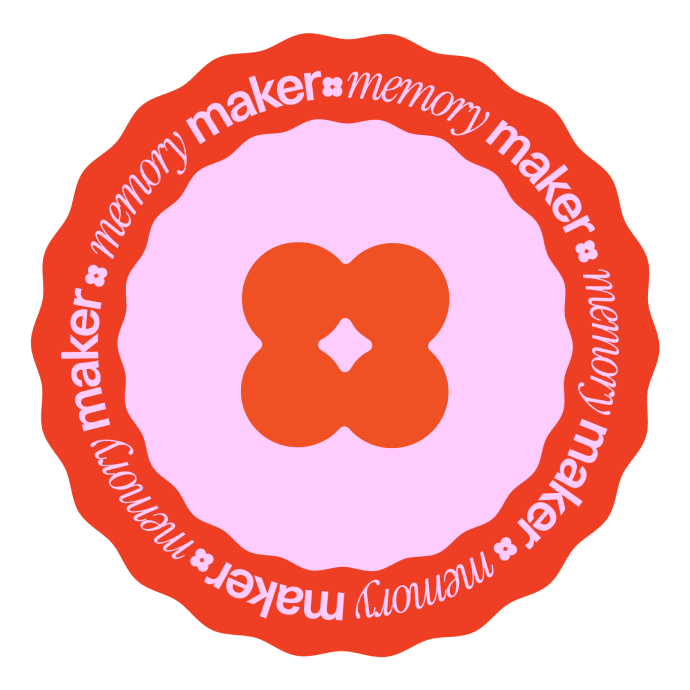 Red and pink circular sticker with flower shape in center and repeated text memory maker around edge.