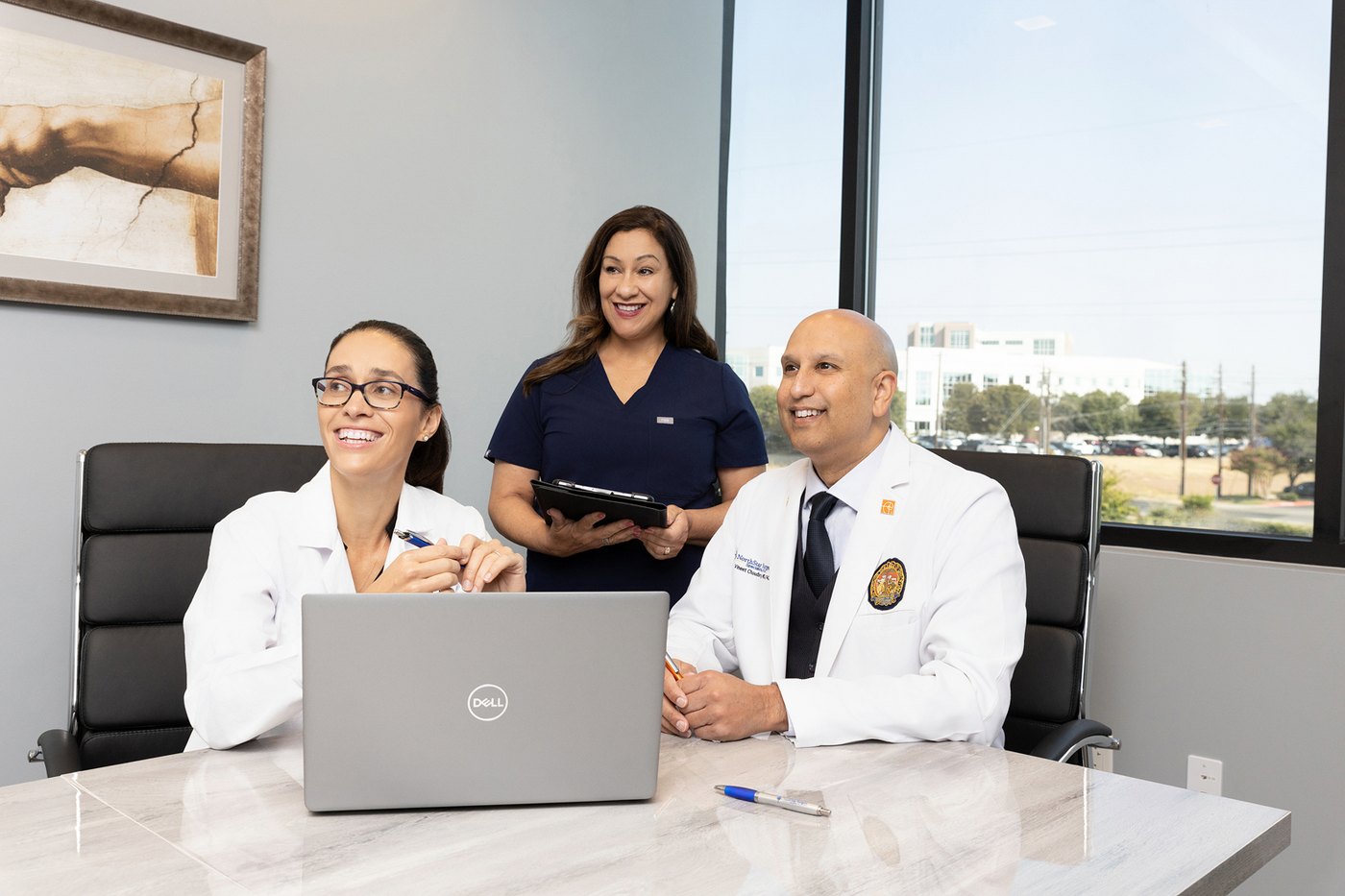 Dr. Cristina Muresanu and Dr. Vineet Choudhry with a NorthStar Surgery team member in consultation