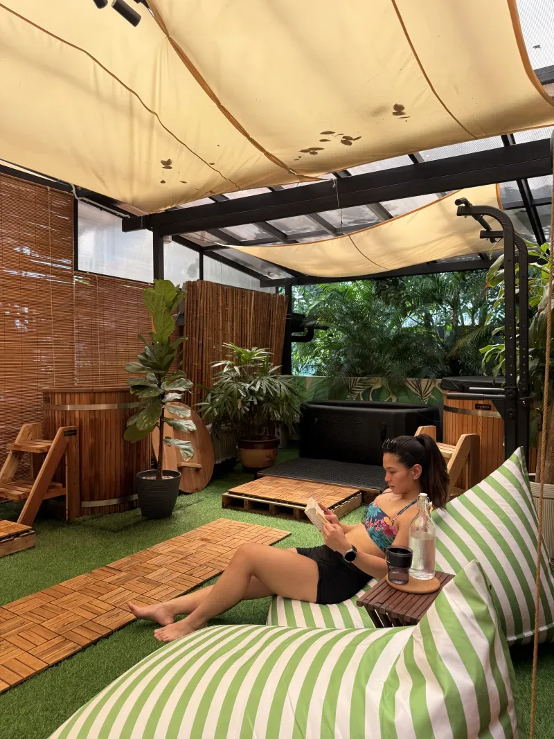 Guest moving between the sauna and cold plunge at The Contrast Garden