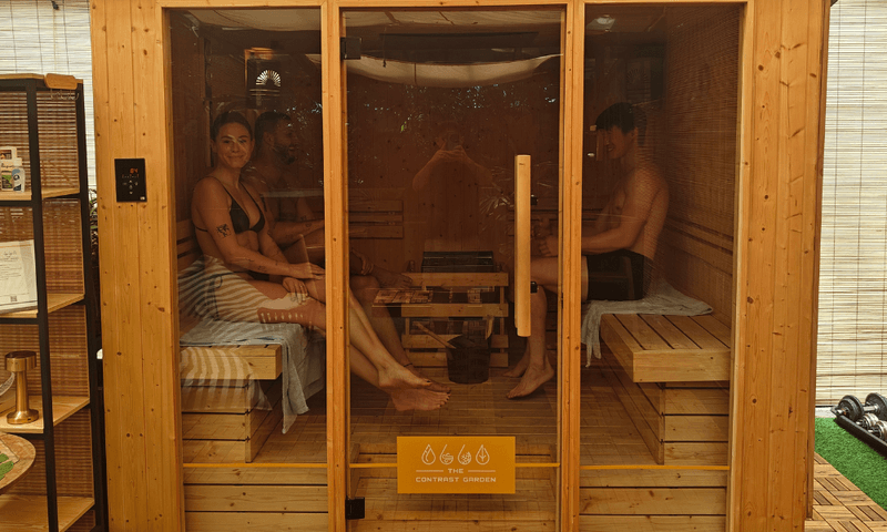 Guests inside The Contrast Garden's sauna