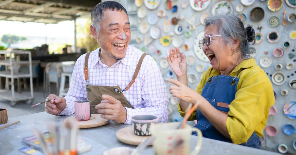 Retired couple working together in a pottery studio