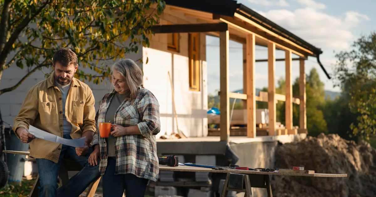 Couple reviewing plans together at golden hour
