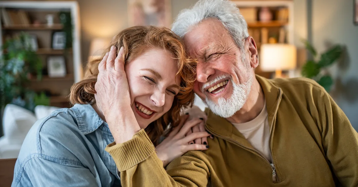 Senior father and daughter embracing