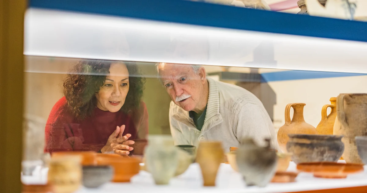 Senior couple studying a museum exhibit together