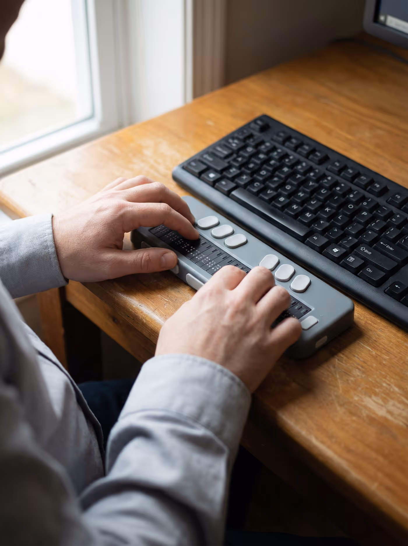 An industrial environment where a worker is analyzing a machine