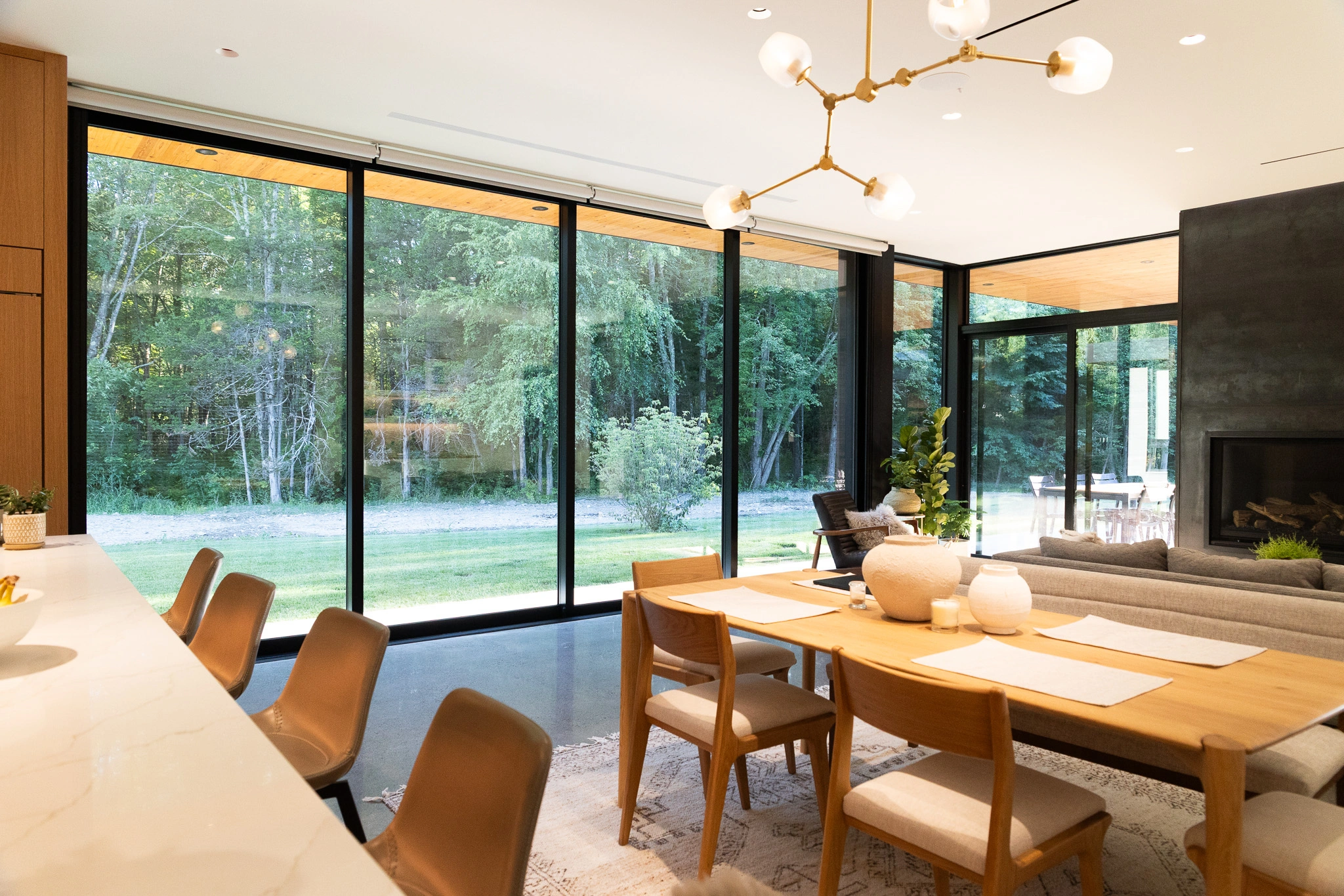 image of modern living room with intelligent lighting and automatic Lutron shades
