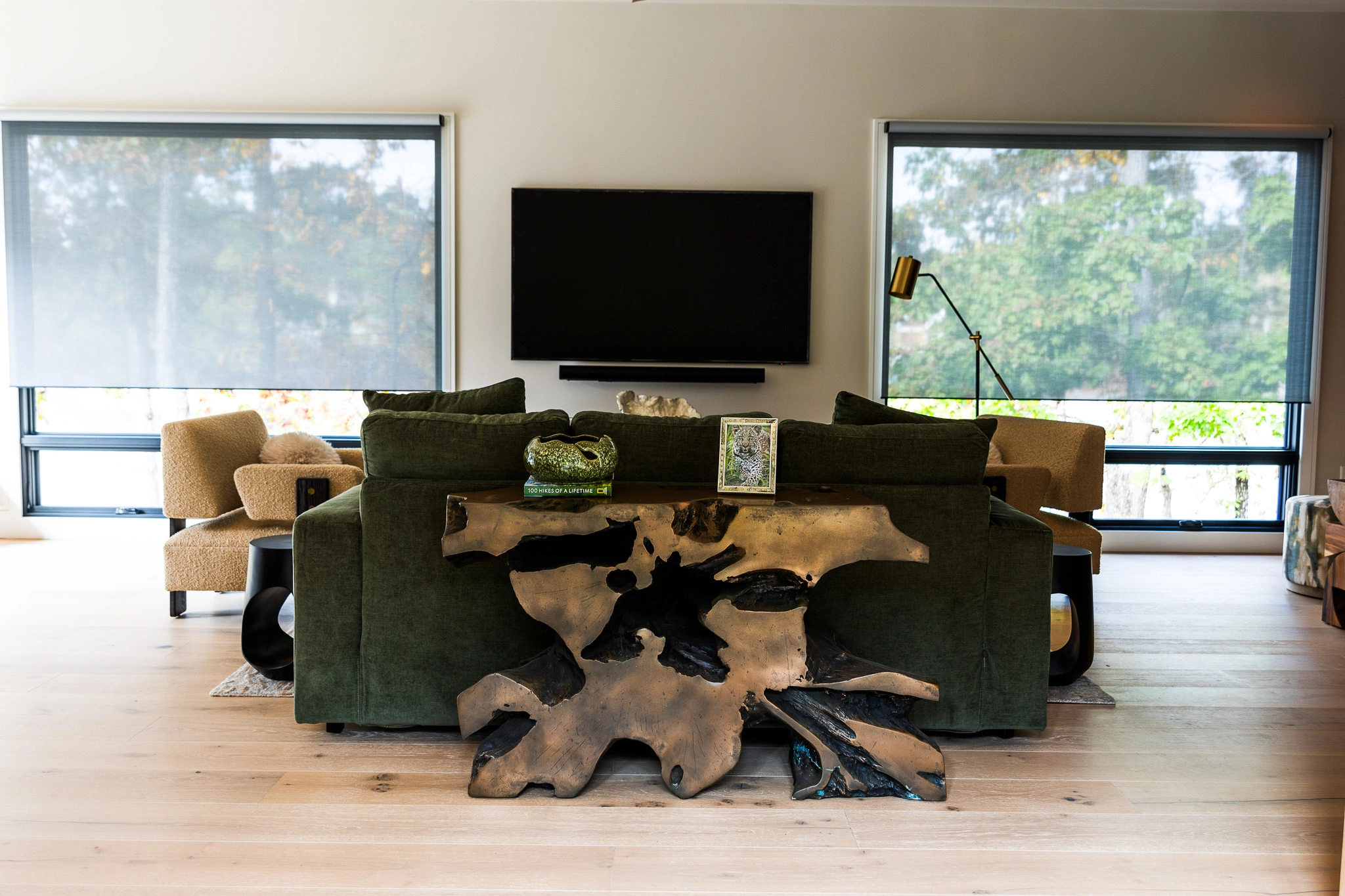 Luxury living room with intelligent lighting and automatic shades installed by iQUARTERS