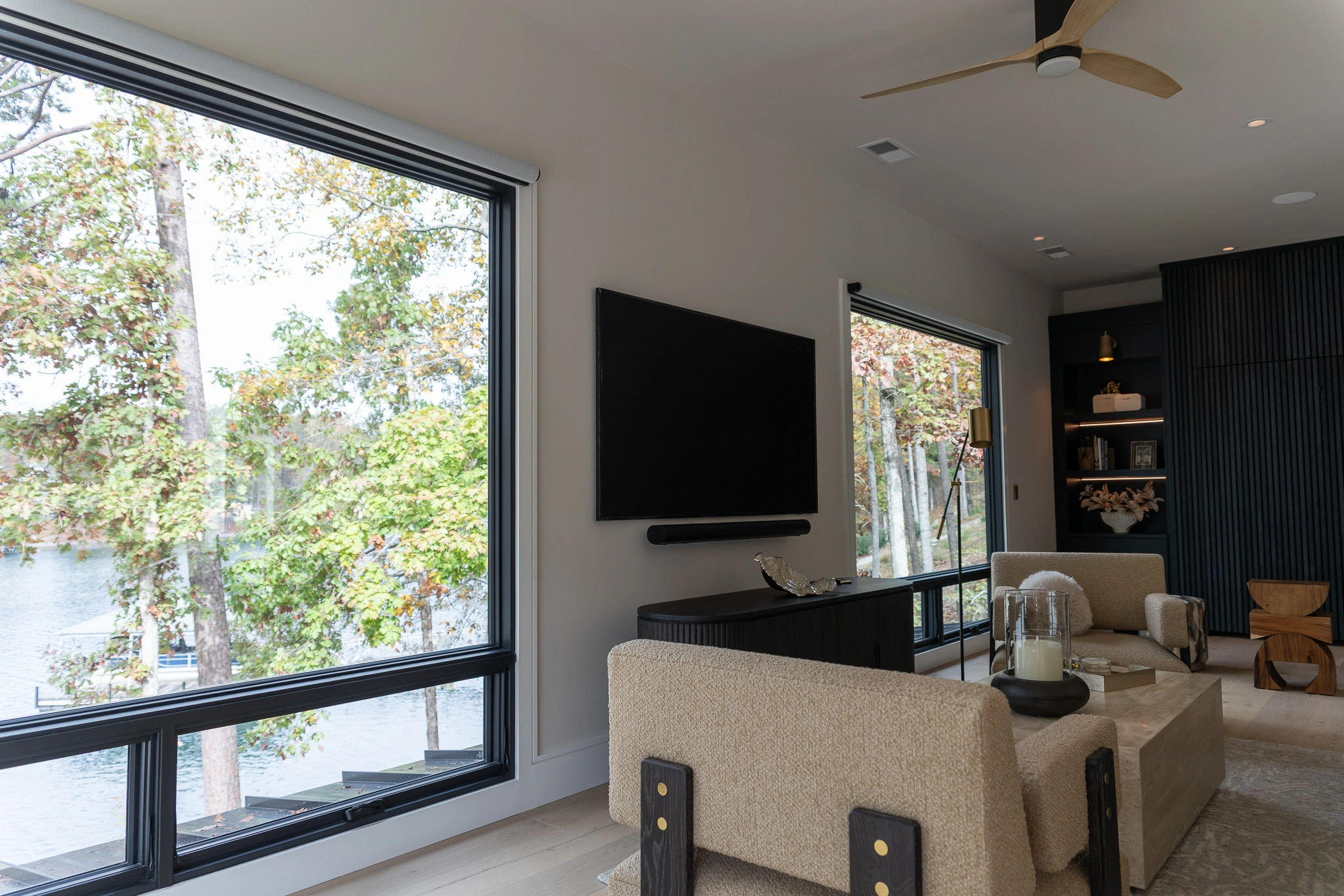 image of luxury living room with automatic shades, and custom audio/video systems