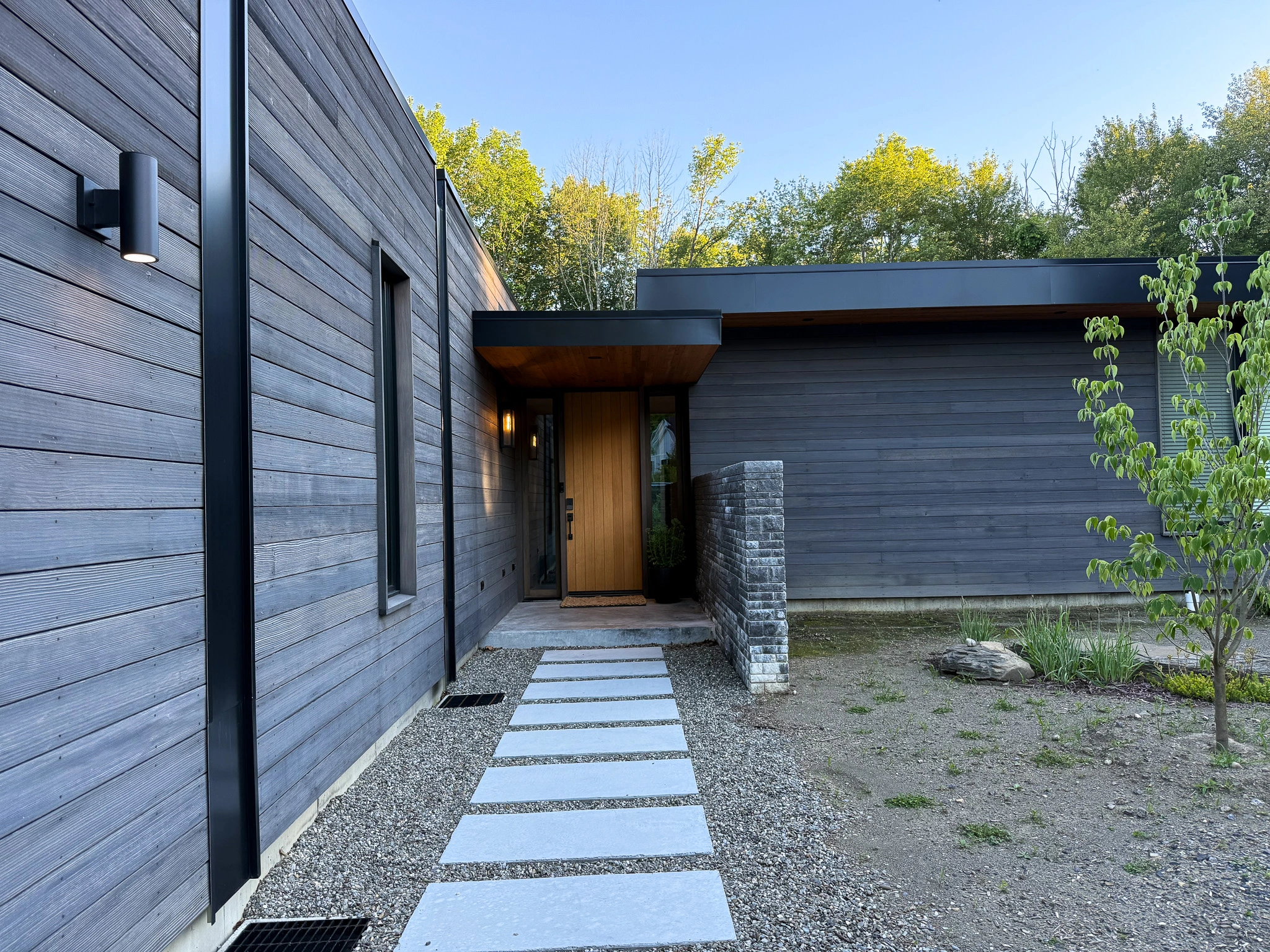 Modern home exterior with automated intelligent lighting design