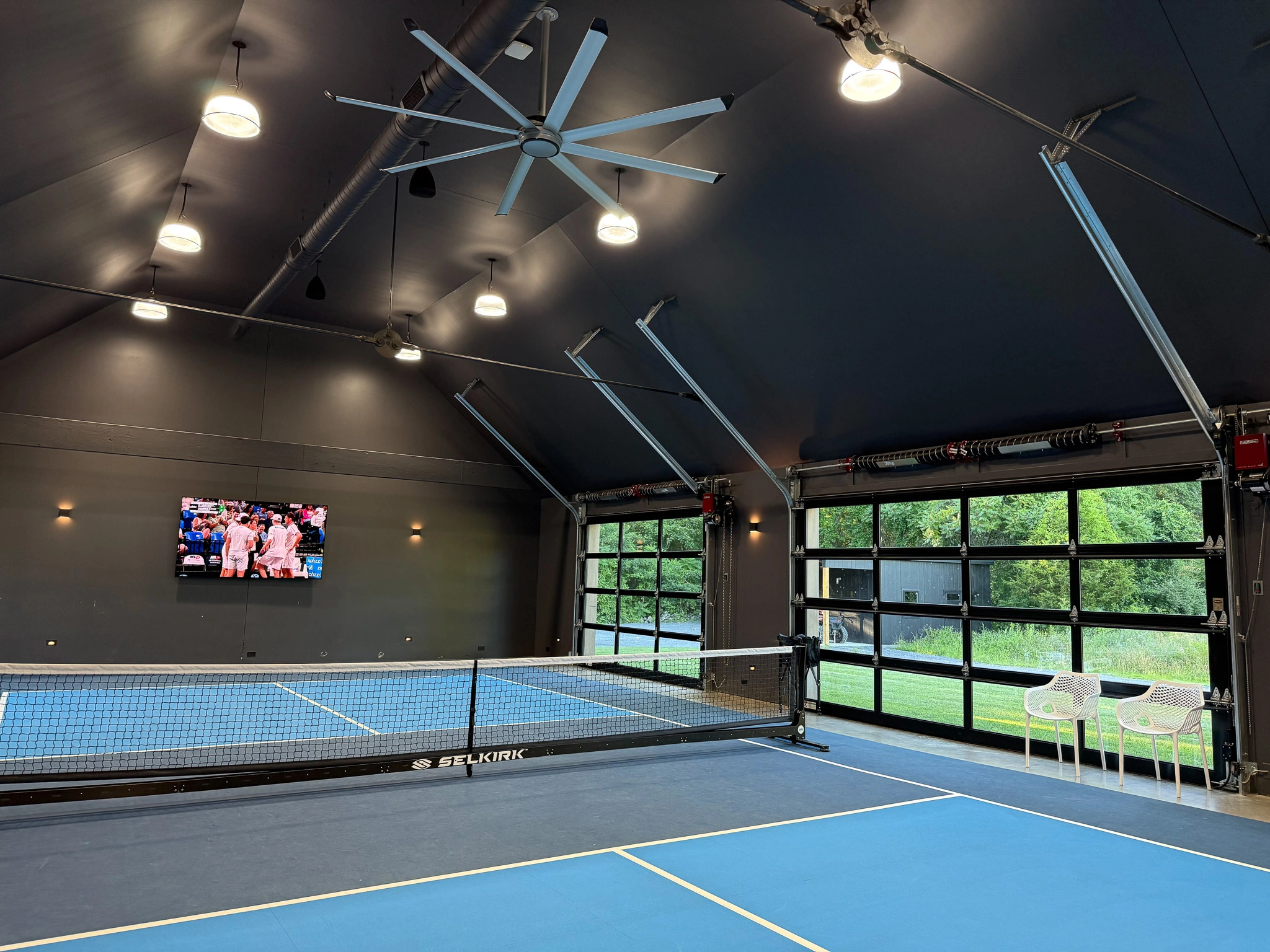 Luxury indoor pickle ball court with intelligent lighting and climate control