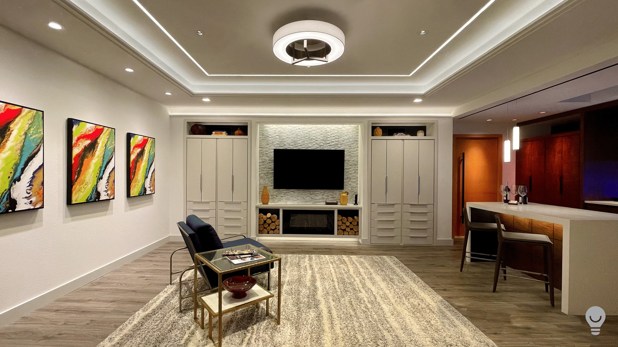 Image of a living room well lit with intelligent lighting and systems.