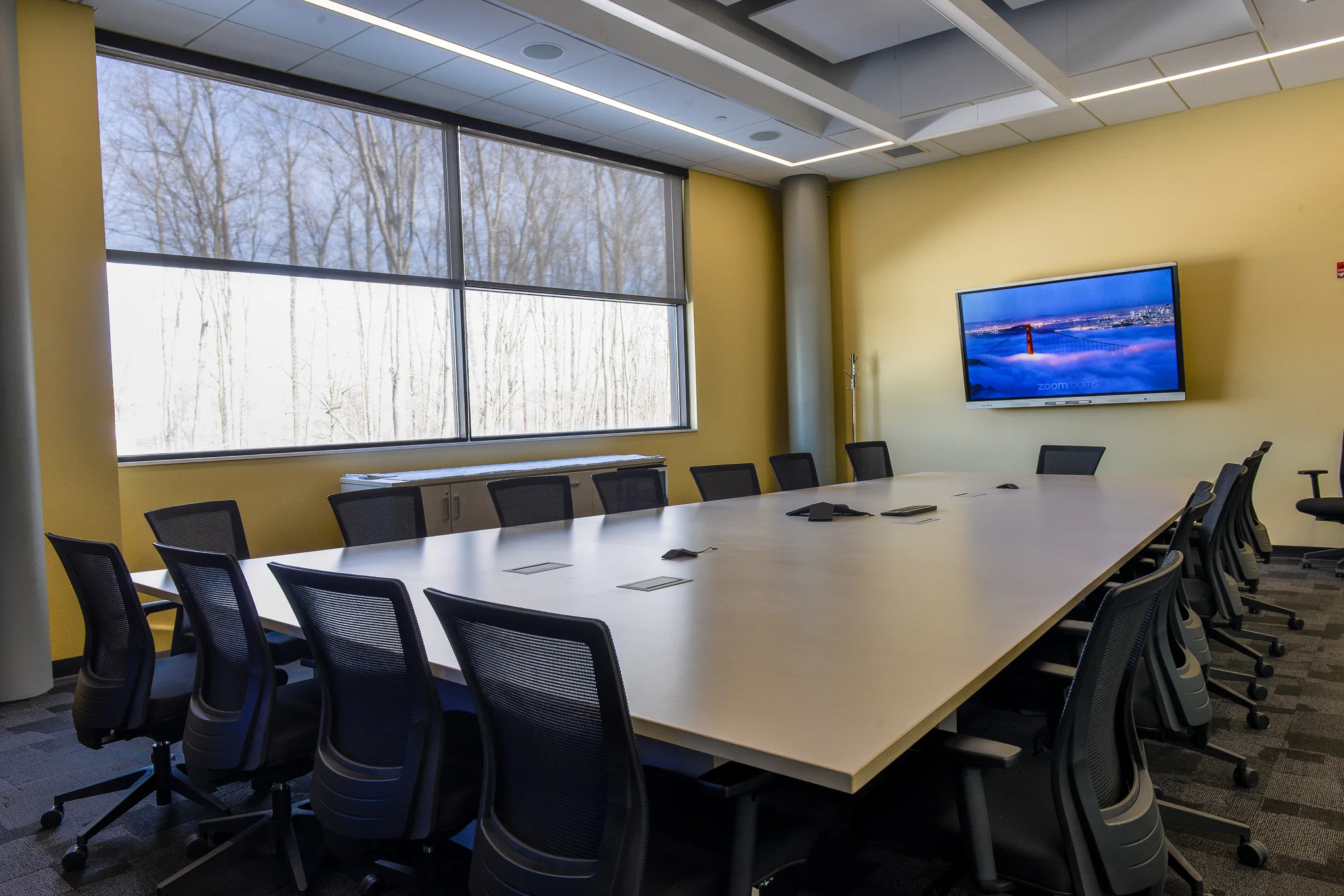 Commercial conference room with integrated audio visual system installed by iQUARTERS
