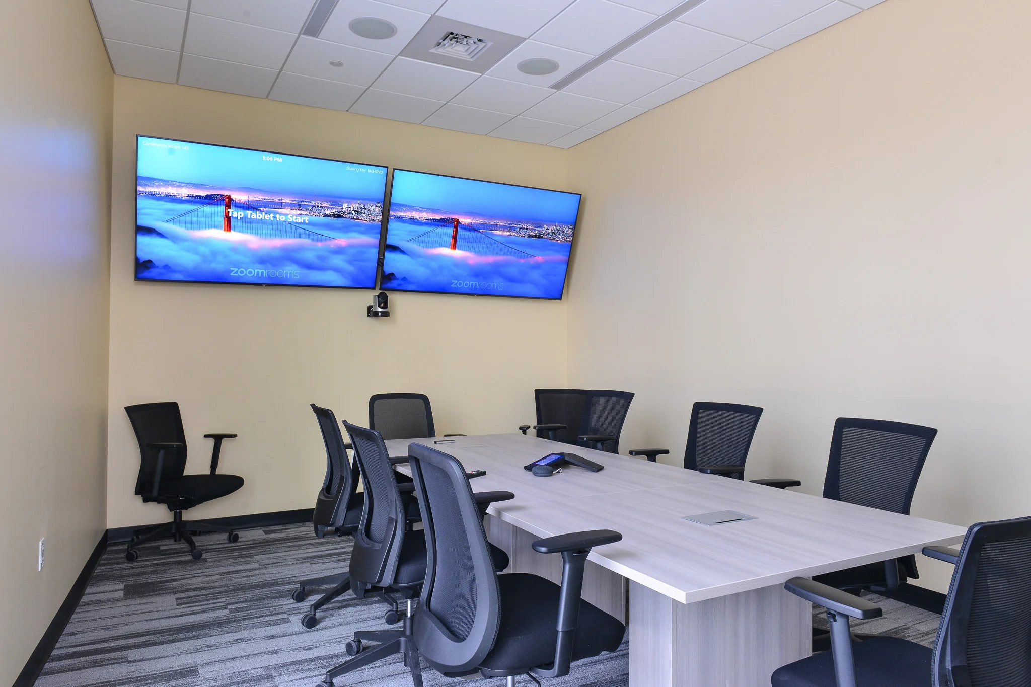 Modern conference room audio visual and video conferencing installation by iQUARTERS