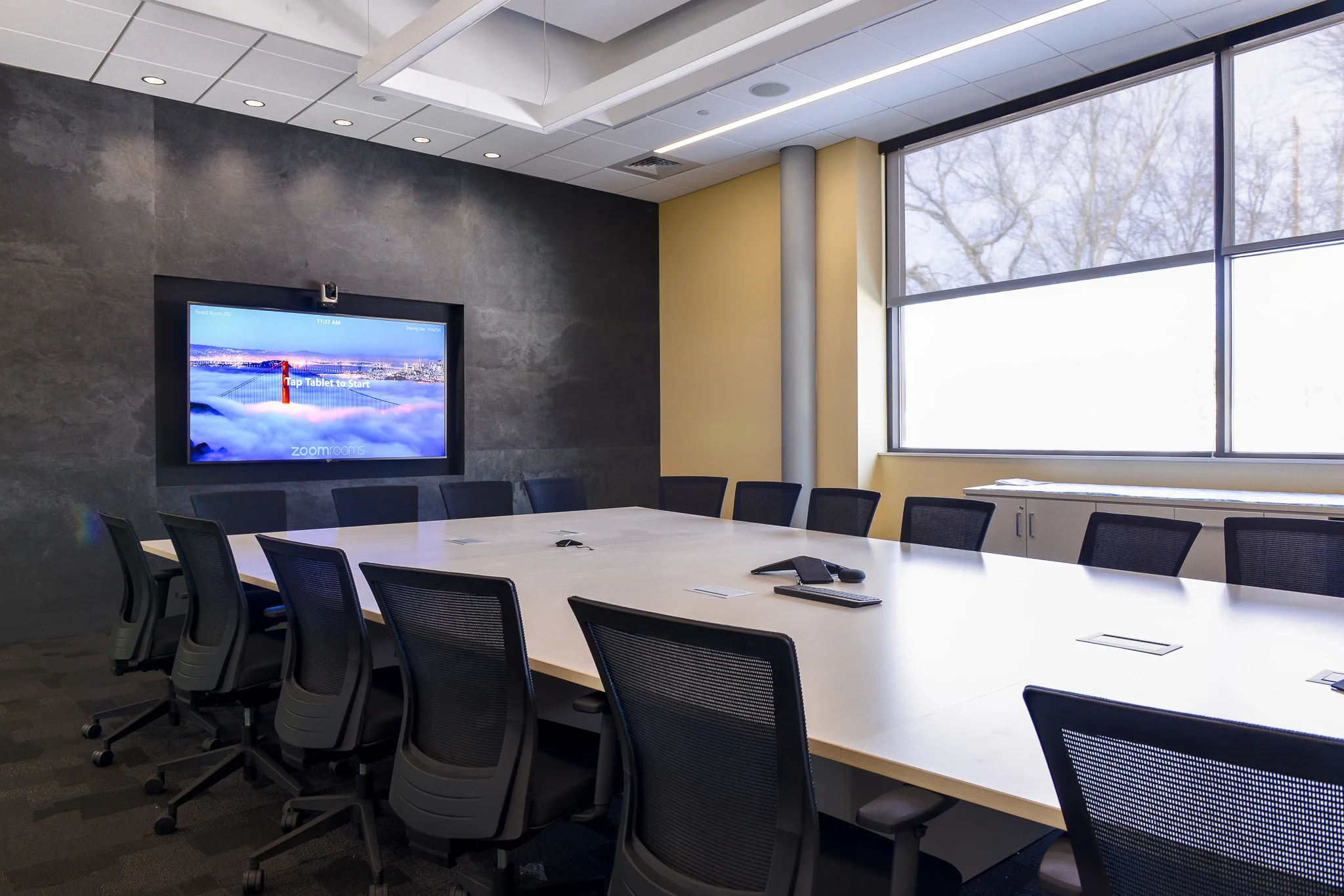 Commercial conference room with integrated audio visual system installed by iQUARTERS