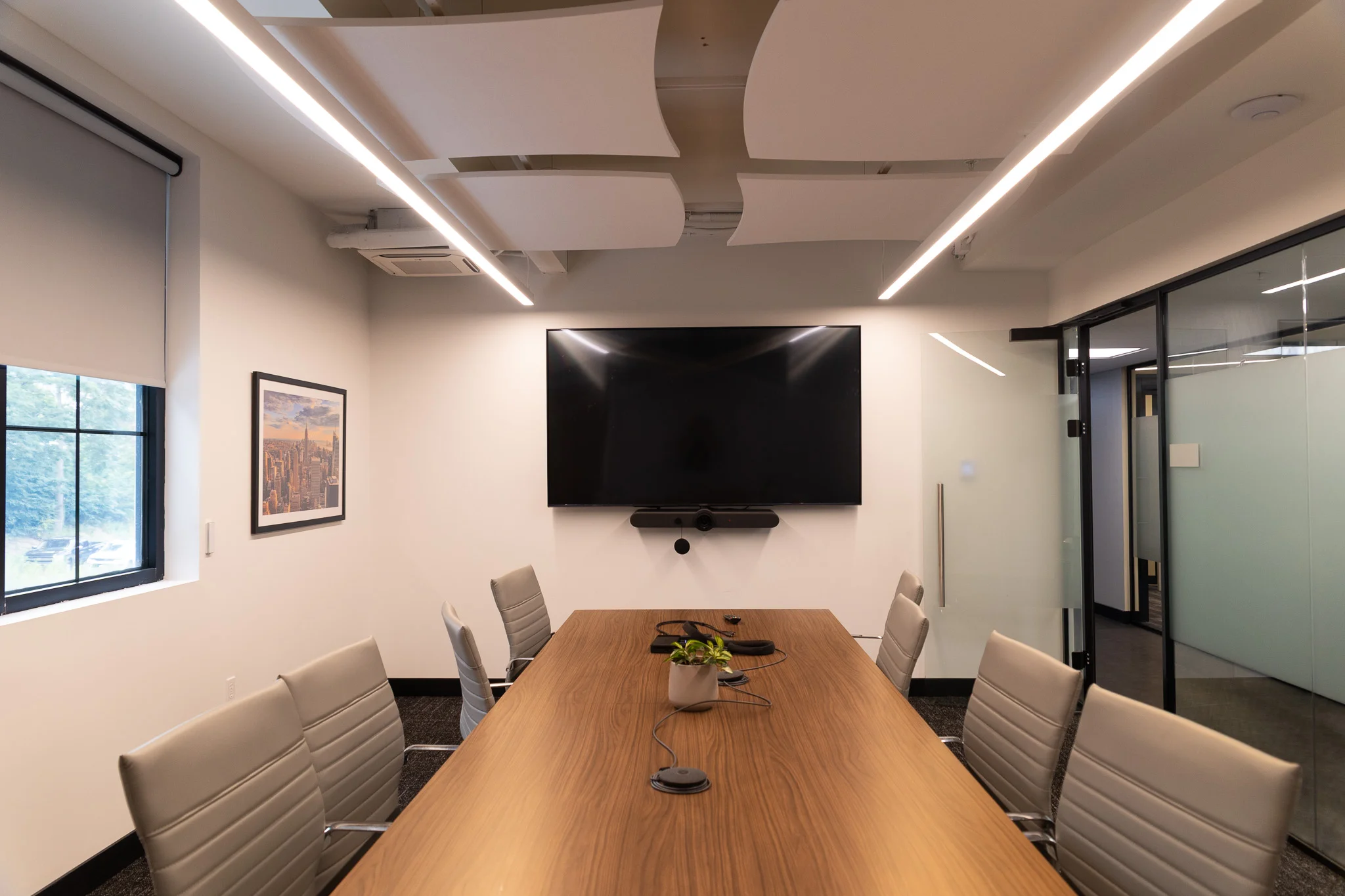 Corporate conference room with intelligent audio visual integration installed by iQUARTERS