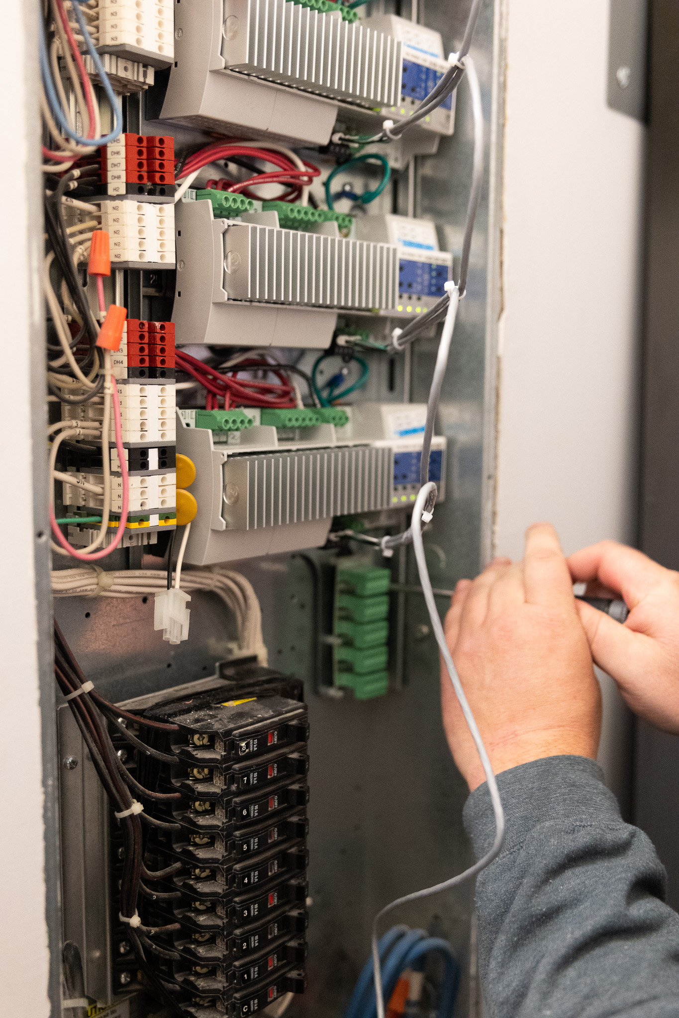 iQUARTERS electrician installing Lutron panels