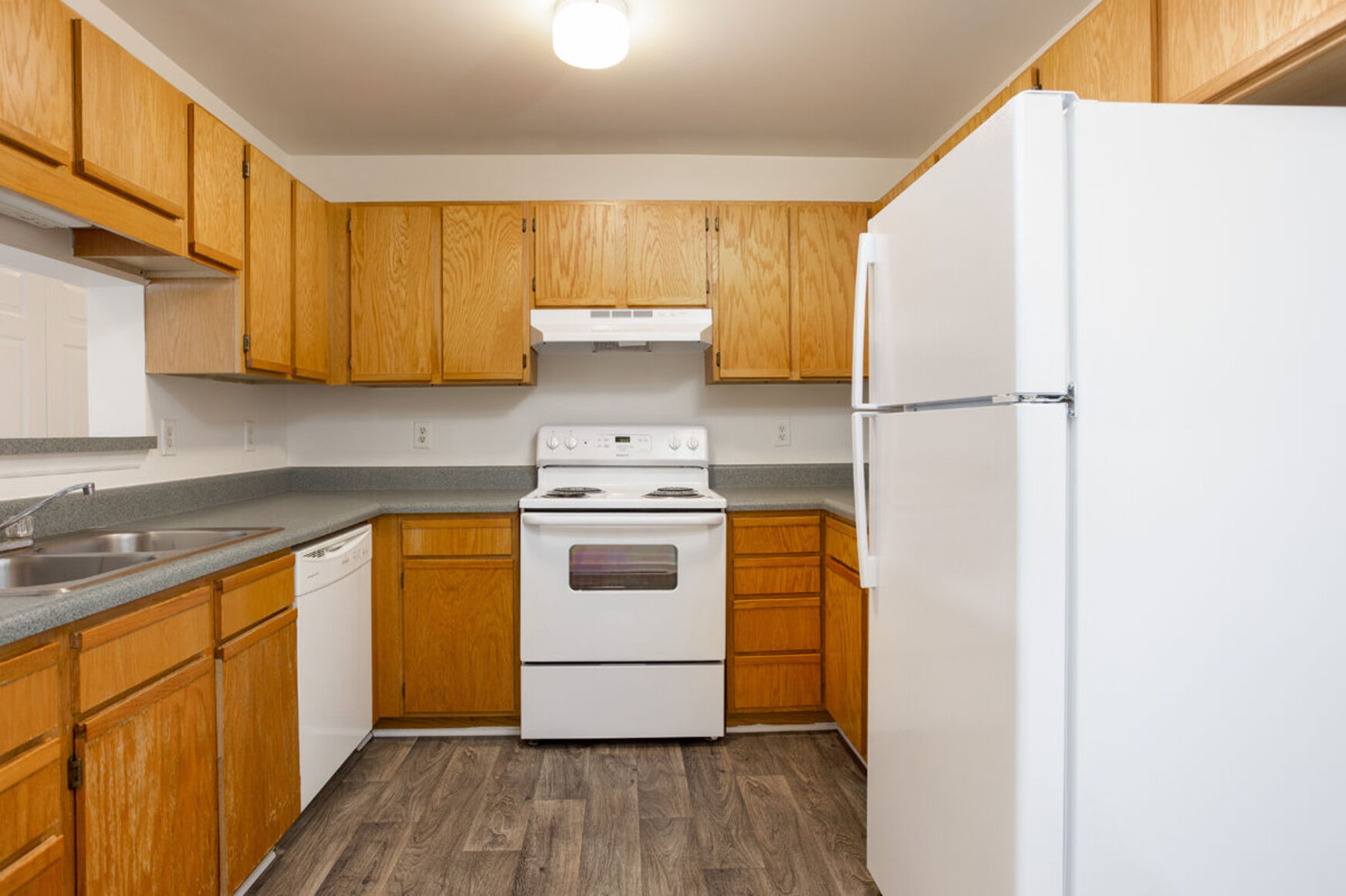Kitchen with brown cabinets