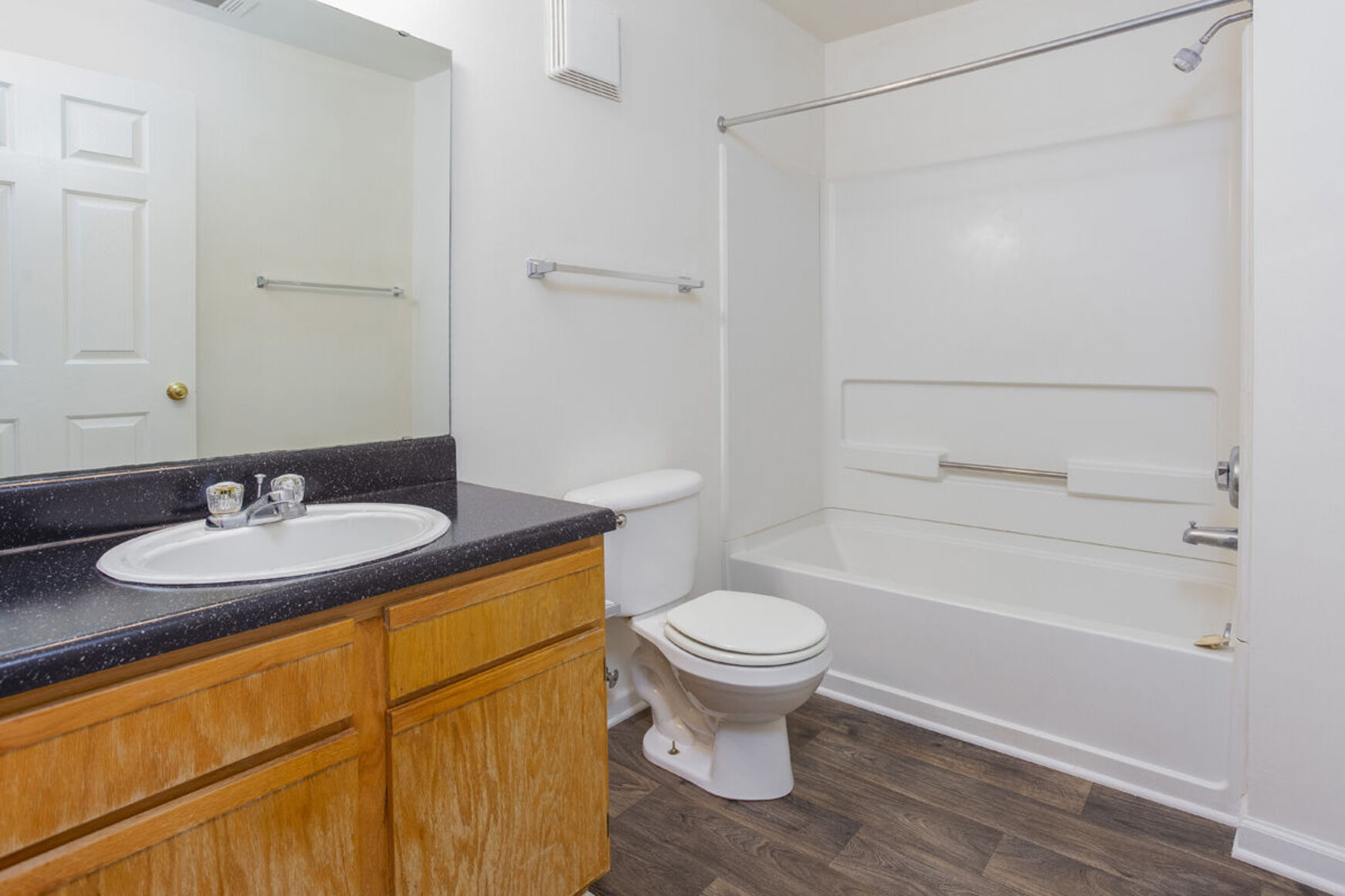 Bathroom with brown cabinets