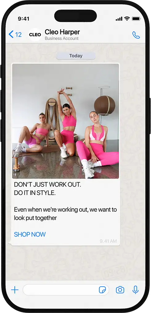 Smartphone screen showing a chat message from Cleo Harper with an image of three women in pink workout outfits posing in a gym, promoting stylish workout wear with the text: 'DON'T JUST WORK OUT. DO IT IN STYLE. Even when we're working out, we want to look put together. SHOP NOW.'