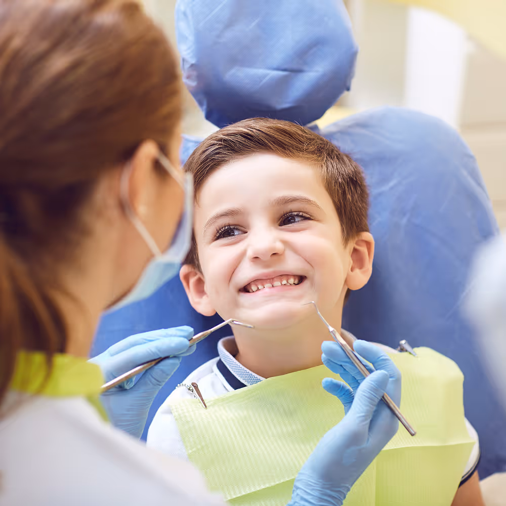 Child receiving preventive dental treatment at a dental clinic