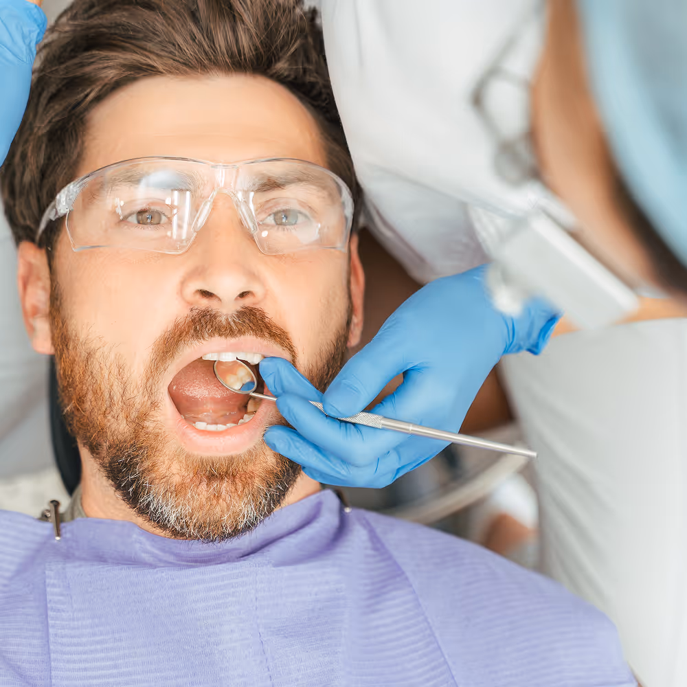 Adult patient receiving tooth colored dental filling treatment