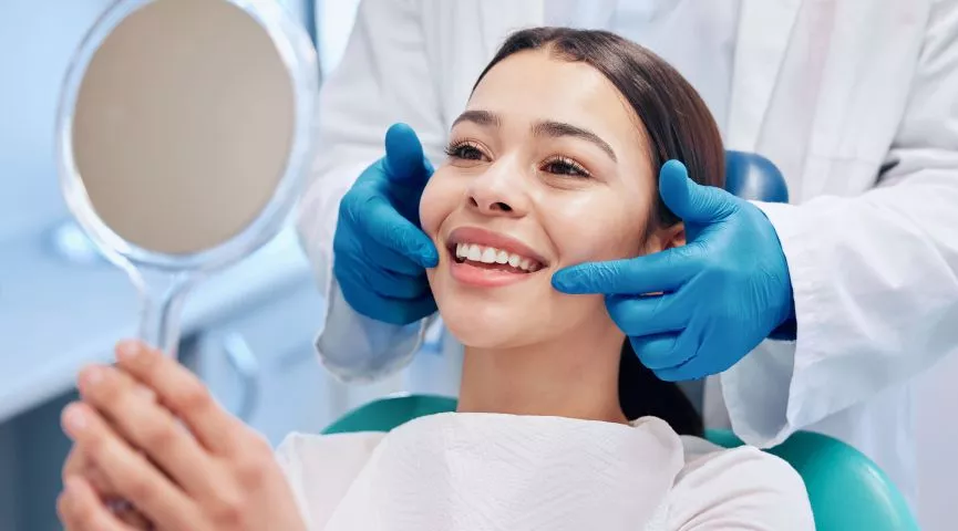 Patient smiling after dental implant restoration at Marvel Dental Clifton