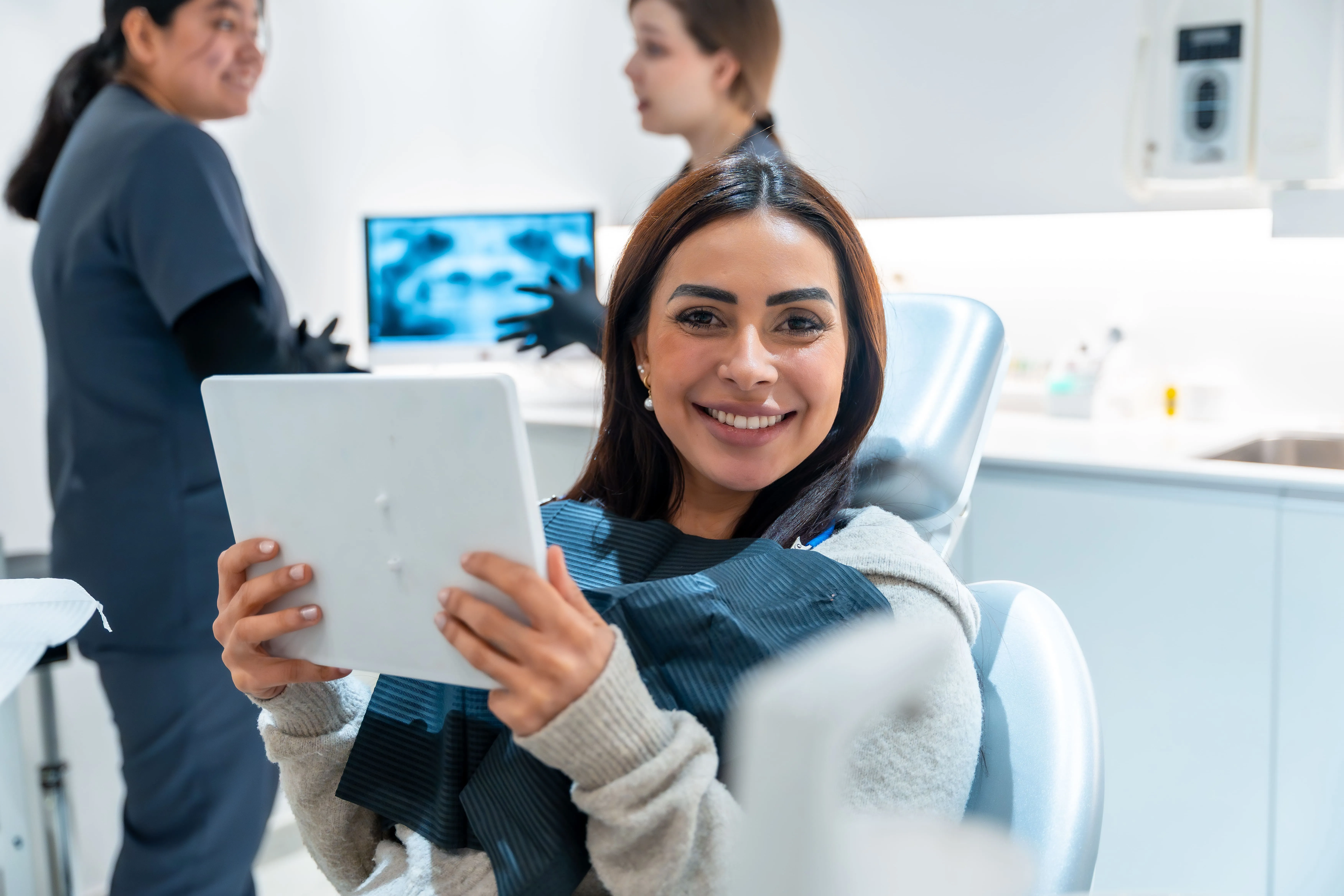 Dentist reviewing digital smile images with a patient near Elmwood Park, NJ